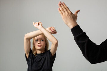 young woman in fear of being hit by a man