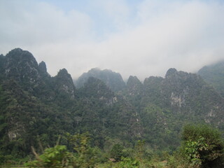 Obraz premium Backpacking down the Mekong river and the jungle landscapes of Laos in Southeast Asia