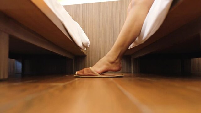 woman feet on wooden floor