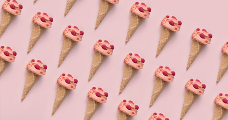 Summer pattern background made with pink raspberry ice cream scoops in cones on pink  pastel background. Minimal creative concept.