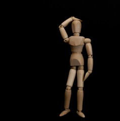 Wooden man on a dark background