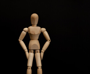 Wooden man on a dark background