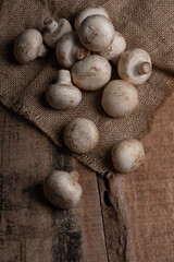 Fresh Button Mushroom on wooden table.