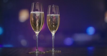 Glass of the Champagne over the city night view