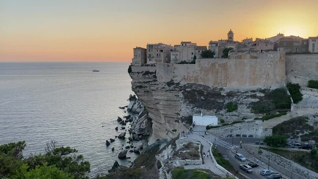 Bonifacio, Corsica, France. Old town Bonifacio on white cliffs at sunset.