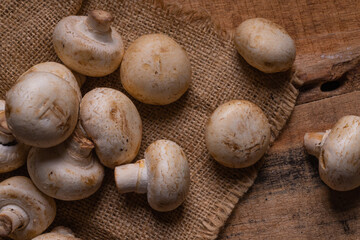 Fresh Button Mushroom on wooden table.