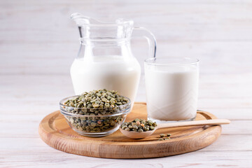 Green peas plant-based milk on a white table. Gluten-free, soy free, lactose-free product