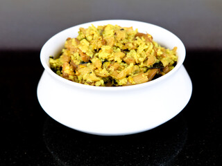 Perum koon or Kerala mushroom curry prepared with bird eye chili and curry leaves