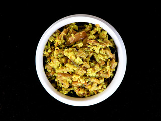 Perum koon or Kerala mushroom curry prepared with bird eye chili and curry leaves