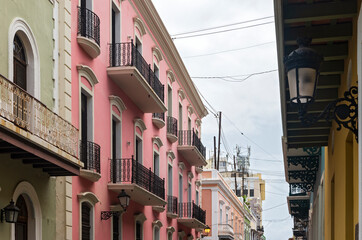 Fototapeta na wymiar facades and balconies line streets of old san juan