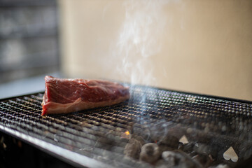 A piece of Picanha meat on grill at home