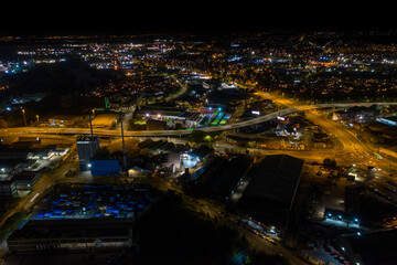Fototapeta na wymiar Night time aerial photo of the the town centre of Leeds in the UK, showing the West Yorkshire British city from above in the evening time