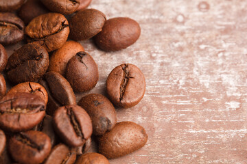 Isolated coffee beans with old wooden background.