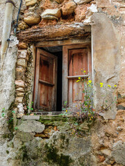 old house facade and  wooden window in poor condition