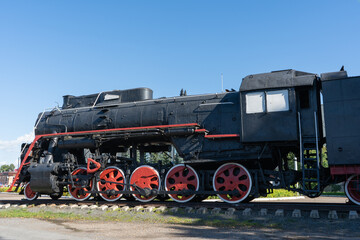 Fototapeta na wymiar Old steam locomotive at the railway station.