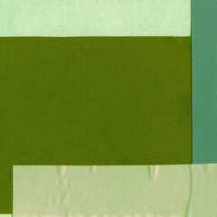 Green torn paper collage close-up. Texture made from various paper and cardboard parts. Damaged old paper background. Vintage blank wallpaper. Material design backdrop.