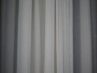 The light gray fabric was glued to the wall. Light gray curtains for interior decoration. Closed curtain use for background
