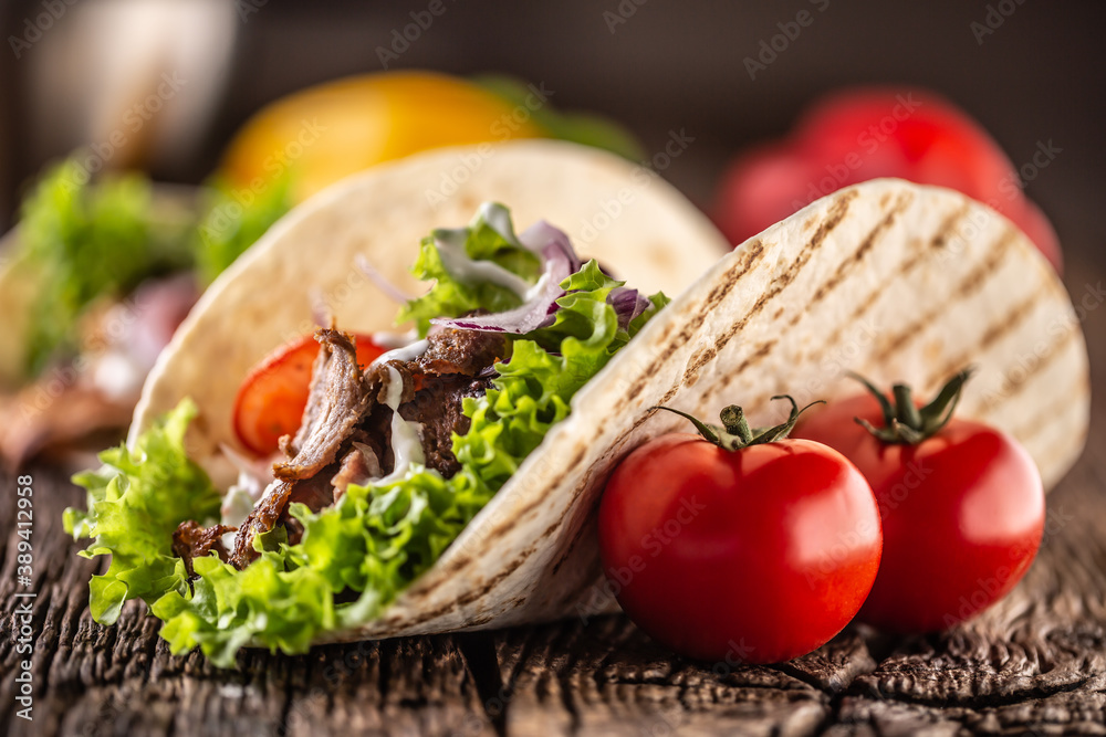 Canvas Prints open meat and veg tortilla on a rustic wooden board