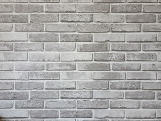 The texture of a gray brick wall or an unevenly colored brick wall is perfect for adding text or as a background.
