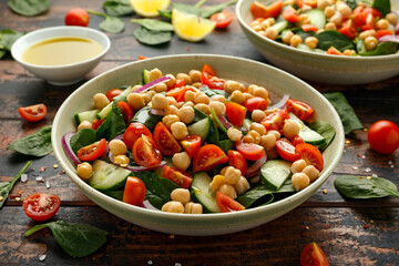 Chickpeas salad with tomato, cucumbers, red onion and greens. Dietary food. Vegan salad.