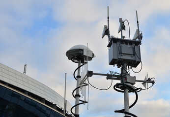 Radar for warning of the appearance of a target and the detection and location of objects. Military locator and antenna equipment vehicle. War or military concept on sunset background. Army exercises