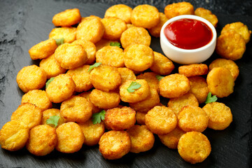 Mini hash browns, tater tots crispy golden potato bites served with jalapeno peppers dipped in ketchup
