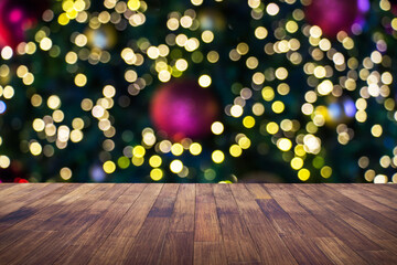 Wood table brown with blurred light bokeh christmas decoration background can be used for display or montage your products.