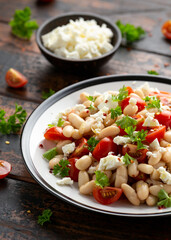 White Bean Salad with Cherry Tomatoes, Feta cheese and parsley. Healthy vegetarian, vegan food