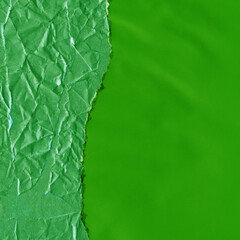 Green torn paper collage close-up. Texture made from various paper and cardboard parts. Damaged old paper background. Vintage blank wallpaper. Material design backdrop.