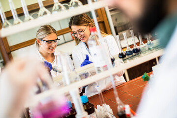 Female researchers in white lab coat working in the laboratory