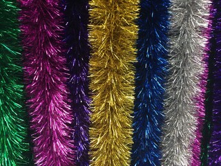 close-up background of a multicolored long tinsel