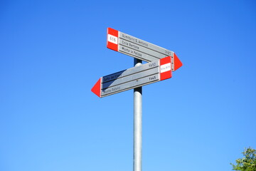 CAI Trekking signals on a pale blue sky, Polino, Terni, Umbria, Valnerina, Italy