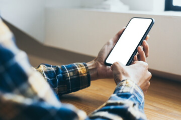 cell phone blank white screen mockup.woman hand holding texting using mobile on desk at coffee shop.background empty space for advertise.work people contact marketing business,technology
