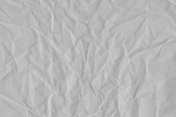 White vintage and old looking crumpled paper background. Retro cardboard texture. Grunge paper for drawing. Ancient book page. Present wrapping.