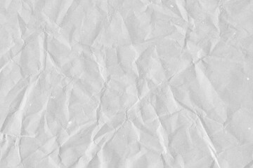 White vintage and old looking crumpled paper background. Retro cardboard texture. Grunge paper for drawing. Ancient book page. Present wrapping.