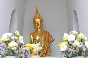 Close up the face of the seated Buddha image name as "Phra Pa Lelai" near the old sanctuary at Wat Nang Chi temple in Phasi Charoen district ,Bangkok Thailand