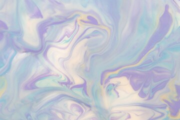 Fototapeta na wymiar Abstract background of mixed shades of nail polish with a pastel marble pattern. Liquid colorful paint background creative pastel with a light shimmer, white lilac, blue, cold