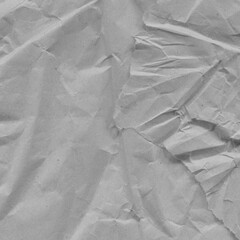 White vintage and old looking crumpled paper background. Retro cardboard texture. Grunge paper for drawing. Ancient book page. Present wrapping.