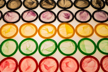 Colorful condoms background.