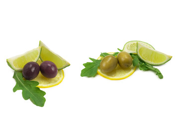 Two olives, piece of lemon and leaves of arugula isolated on white