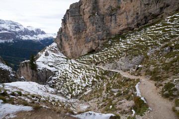Fototapeta na wymiar hiking trekking path from wolkenstein to the stevia hut with the first snow in october 2020, beautiful nature dolomites