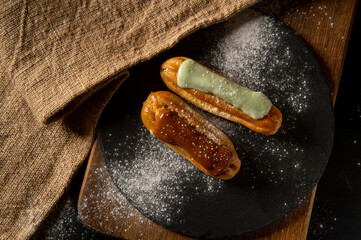 Eclairs. Eclairs are on the table. Confectionery. Serving. Decoration.