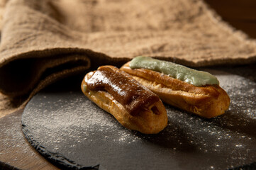 Eclairs. Eclairs are on the table. Confectionery. Serving. Decoration.