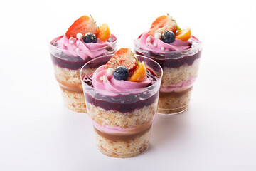 Delicious dessert in a glass on a white background