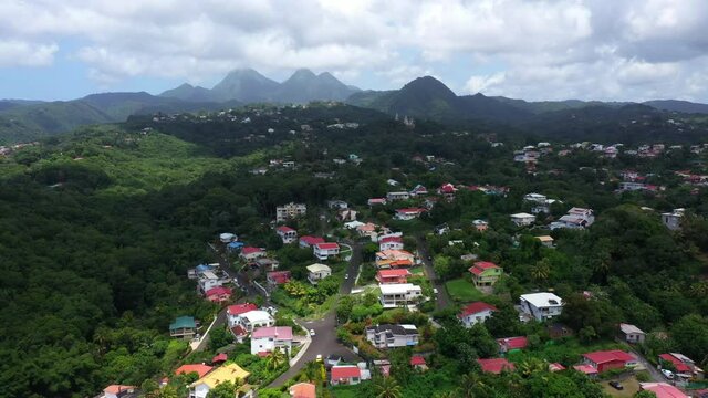 Residential rich neighborhood aerial view over houses Piton du Carbet mountains Martinique