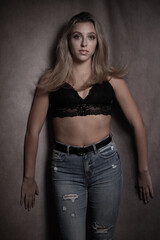 Moody dark portrait of a beautiful young woman