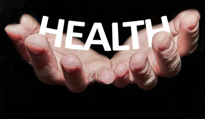 Hands holding the word health