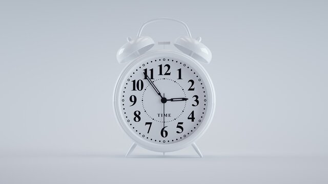Close-up of an analog alarm clock on white background. (White)