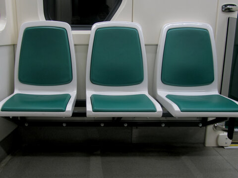 Three Green Empty Seats On A Subway Train