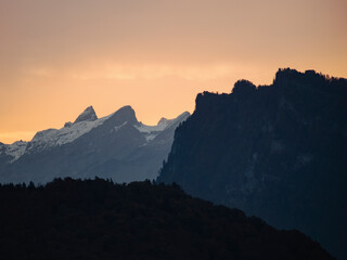 Fototapeta na wymiar Swiss mountain silhouettes at sunrise